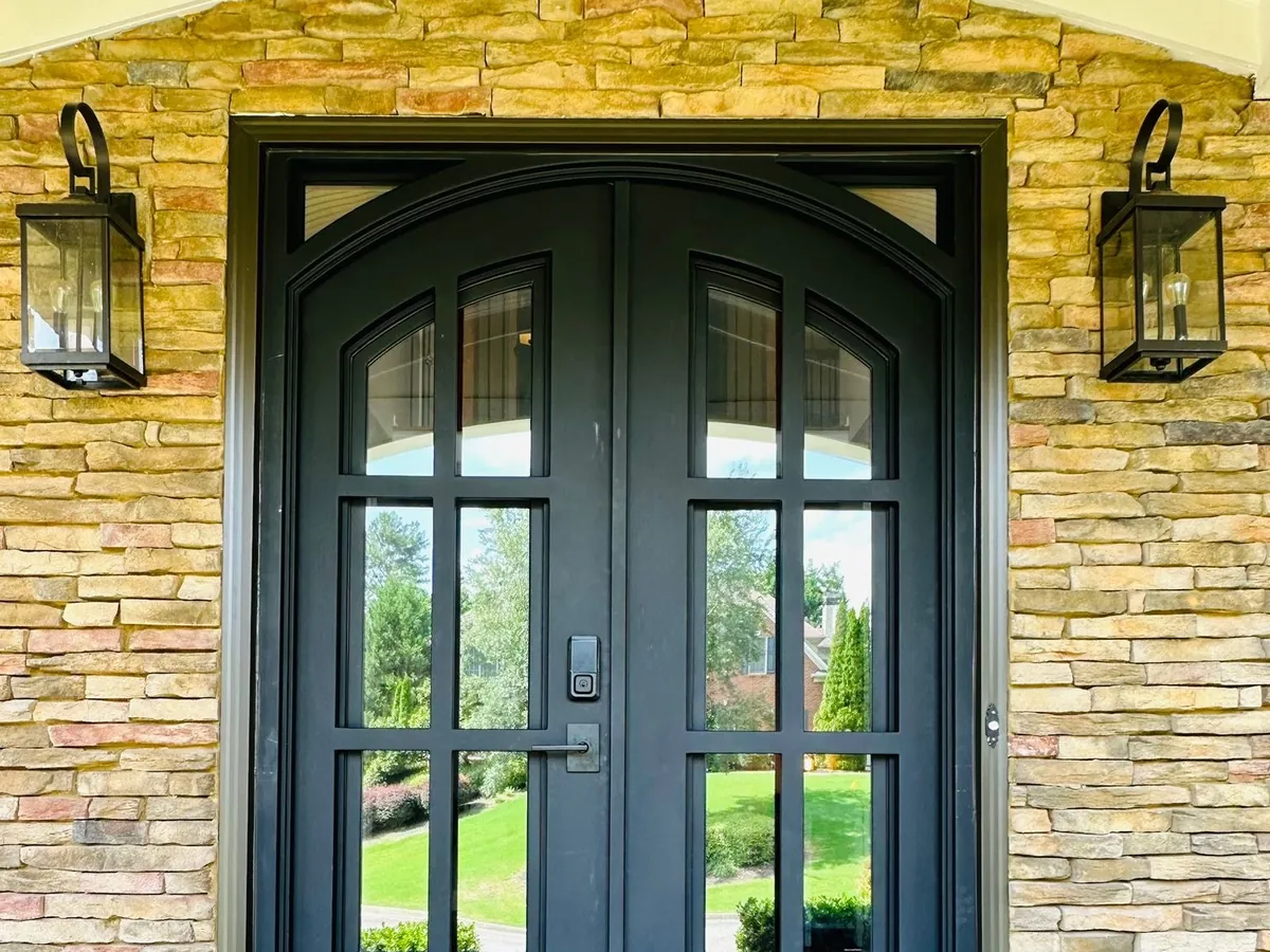 Black double entry door with arched glass